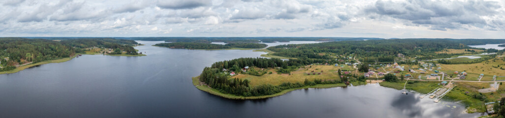 Aerial view of the nature of Karelia. Ladoga lake. Panorama of nature and private houses from above