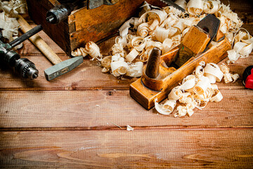 Hand planer with wooden sawdust. 
