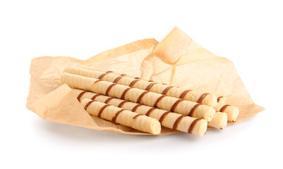 Parchment with tasty wafer rolls isolated on white background