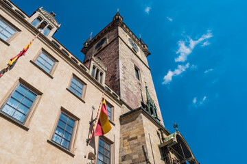 Fototapeta na wymiar Orloj perspective on Old Town Hall with tower and spiers, Prague - Czechia
