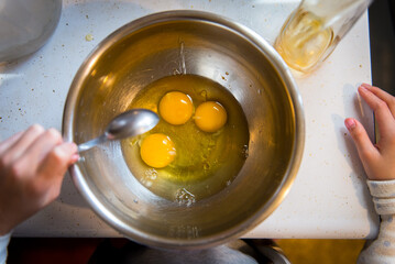 Baking and 3 eggs in a bowl