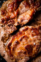 Grilled pork steak on paper. 