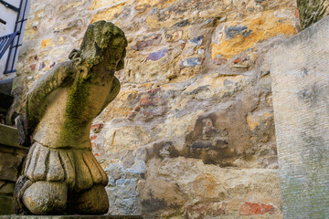 Ancient sculptures in the architecture of the city. Historical and cultural heritage. Background.