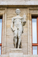Ancient sculptures in the architecture of the city. Historical and cultural heritage. Background.