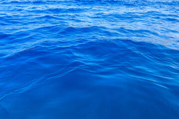 Very nice sea water background or backdrop with selective focus. Small waves of natural water...