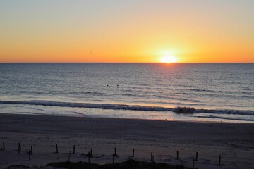 Sunrise at the beach, golden sky. 