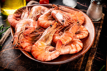 Boiled shrimp in a wooden plate. 