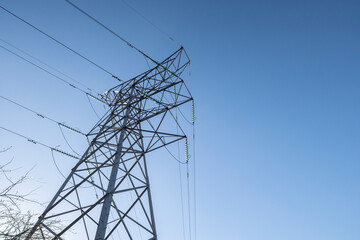 Electircity pylons against a clear blue sky on a cold winters day in staffordshire