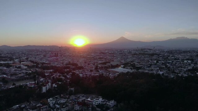 Puebla at Dramatic evening Sunset aerial drone shot of City Center in Puebla de Zaragoza, Puebla State, Mexico