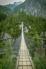 Suspension bridge close to Grimselpass in Swiss Alps