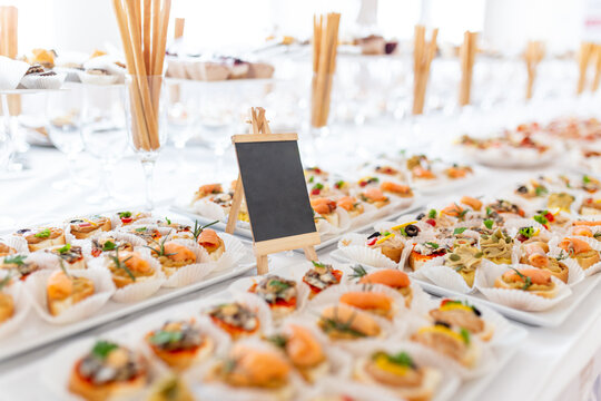 Fresh appetizers on plates. Food and event concept. Copy space.