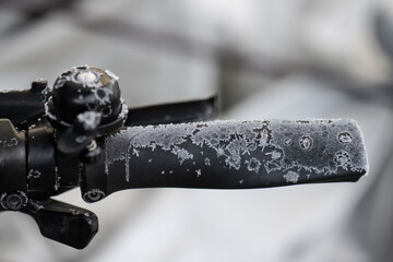 Ice crystals forming on a rubber bicycle handle.