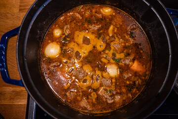 Pot of meat stew cooking.
