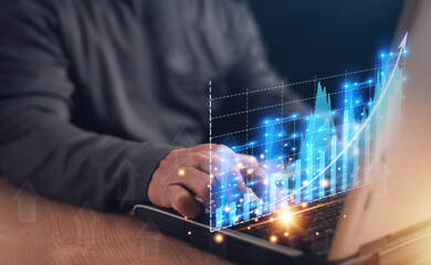 Business analytics and financial concept, Businessman using laptop computer to analyze graph for investment, Corporate future growth plan, Digital marketing, Business planning and strategy...