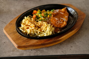 close-up of a bowl of soba noodles with sliced roast beef steak. Asian cuisine