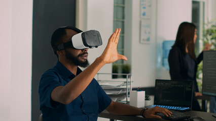 Database admin working with virtual reality glasses to develop server app in it agency office, using source code. Checking programming language on cloud computing database, web developer.