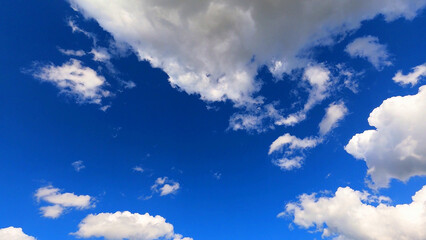 white clouds float in the blue sky