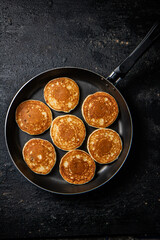 Homemade pancakes in a frying pan. 