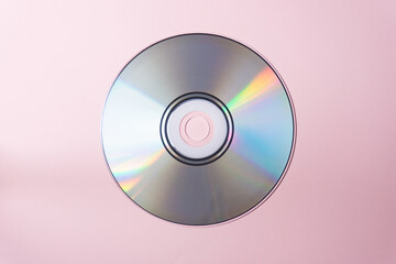 CD record on a pink background. Photo for banner on your website about music