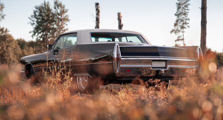 Fototapeta premium American car, black and white old retro car with tail lights