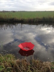 red umbrella on the river