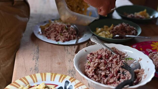 Serving traditional central America food breakfast rice and beans