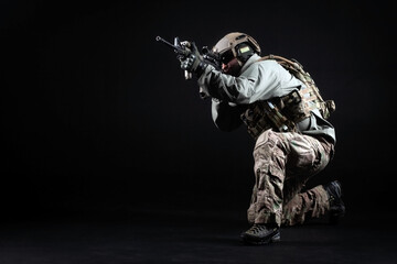 American special forces, a soldier in a military uniform with a weapon attacks on a black...
