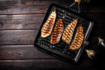 Pieces of eggplant grilled in a grill pan. 