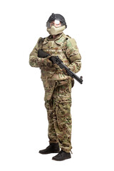 soldier in military equipment with a shotgun on a white background, commando in uniform with a weapon