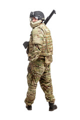 soldier in military equipment with a shotgun on a white background, commando in uniform with a weapon