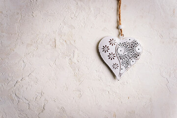 Vintage toy heart on white textured background. Valentines day concept. Top view, flat lay, copy...