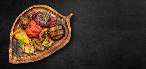 Grilled vegetables and mushrooms on a wooden board