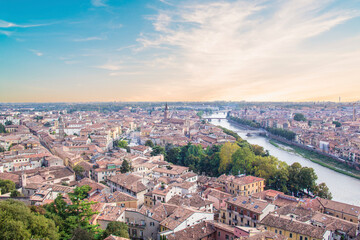 Fototapeta premium Beautiful view of the panorama of Verona and the Lamberti tower on the banks of the Adige River in Verona, Italy