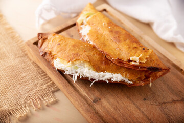 Quesadillas fritas. Traditional Mexican appetizer "garnacha"..Deep Fried handmade corn tortilla that can be filled with a wide variety of ingredients, cheese, pork rinds, meat, etc.