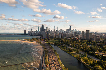 Downtown Chicago city skyline aerial centered over traffic along Lake Shore Drive between South...