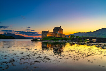 Eilean Donan Castle at sunset in Scotland