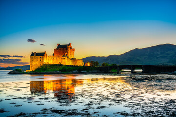 Eilean Donan Castle at sunset in Scotland