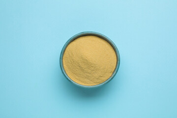 Beer yeast powder on light blue background, top view