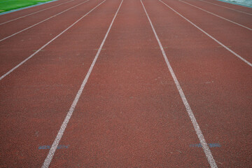 Fototapeta premium Empty fast running lane in outdoor sport stadium