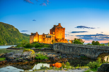 Naklejka na ściany i meble Eilean Donan Castle at sunset in Scotland