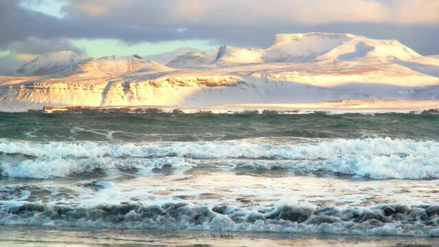 Icelandic Fjords During Sunset. Ocean Coast With Snow Covered Mountains. Winter Landscape in the North Europe Country. Landscape in Iceland. Shot in 8k Resolution 4320p