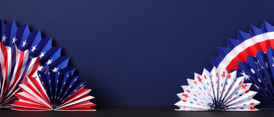 Happy Presidents Day banner with paper fans in the colors of the American flag on dark blue background. USA Independence Day, American Labor day, Memorial Day, US election concept.