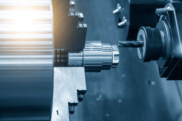 The multi-tasking CNC lathe machine  milling cut the metal shaft parts by milling turret. - obrazy, fototapety, plakaty