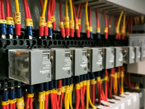 image of a row Schneider plug in relay.Image may contain noise or grain due to low light.