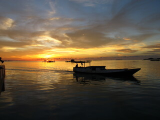 Fototapeta na wymiar sunset at karimunjawa island with boat view