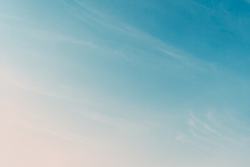 Abstract pastel blue sky with white cloud background.