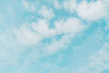 Abstract pastel blue sky with white cloud background.