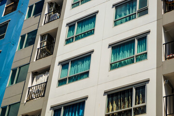 Modern condominium building residence downtown against blue sky