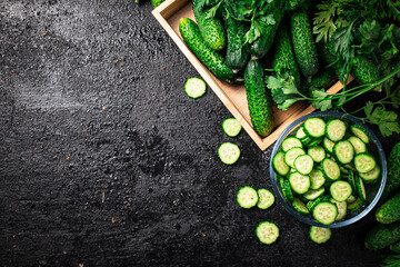 Full glass bowl of chopped fresh cucumbers. 