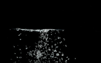 Underwater air bubbles splash isolated on black background.	